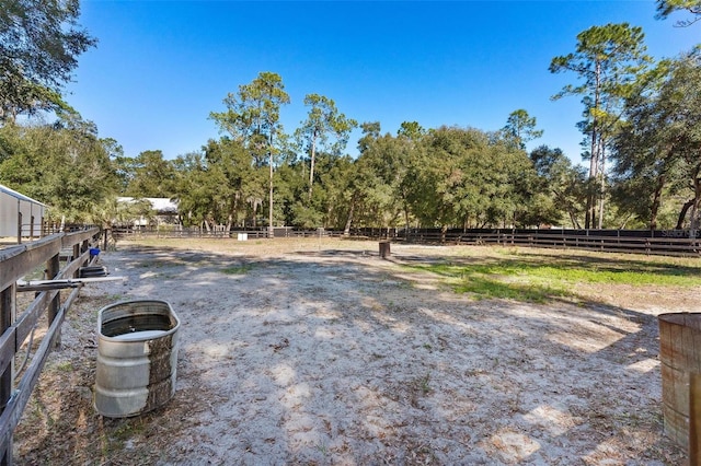 view of yard with a rural view