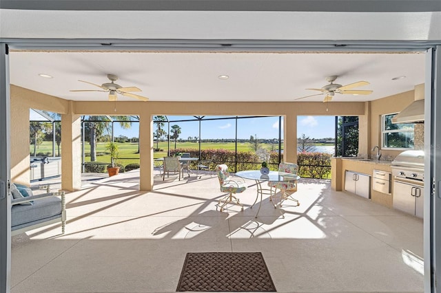 sunroom with ceiling fan and a wealth of natural light