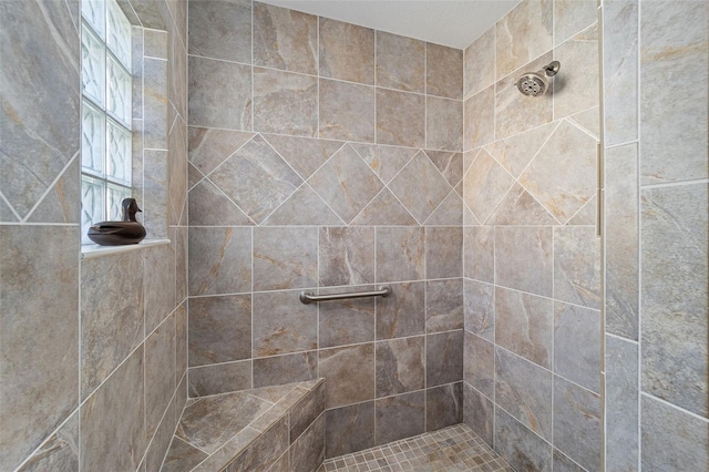 full bathroom with a tile shower