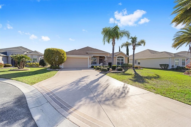 ranch-style house with a front yard, concrete driveway, an attached garage, and stucco siding