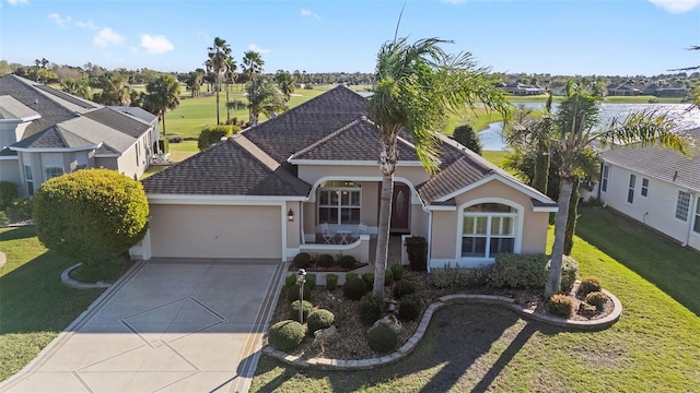 view of front of house with a garage, driveway, a front yard, and stucco siding