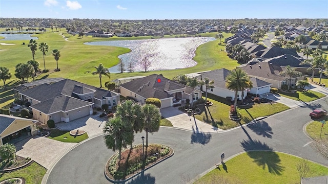 drone / aerial view featuring a water view, a residential view, and golf course view