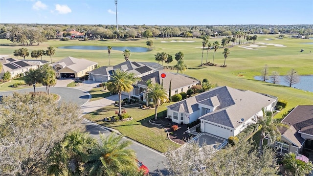 aerial view with view of golf course and a water view