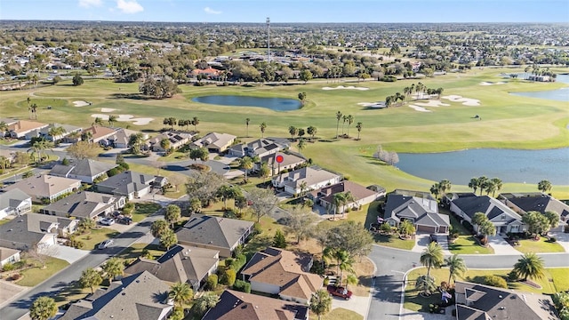 aerial view featuring a water view and golf course view