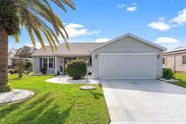 ranch-style home featuring a front yard and a garage