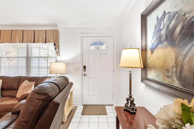 foyer with a textured ceiling, light tile patterned flooring, crown molding, and a wealth of natural light