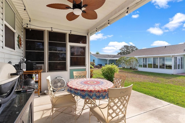 view of patio / terrace with a sunroom and ceiling fan