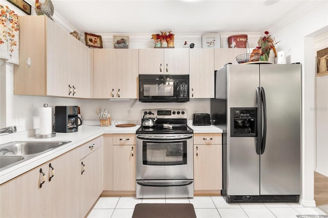 kitchen featuring light countertops, light tile patterned floors, light brown cabinetry, and stainless steel appliances