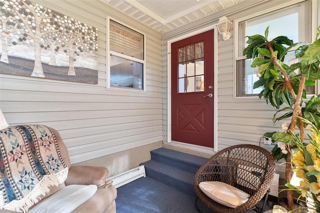 view of exterior entry featuring a baseboard heating unit