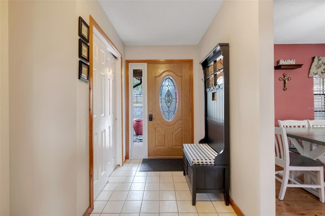 foyer featuring light tile patterned flooring