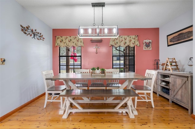 dining space with light hardwood / wood-style floors