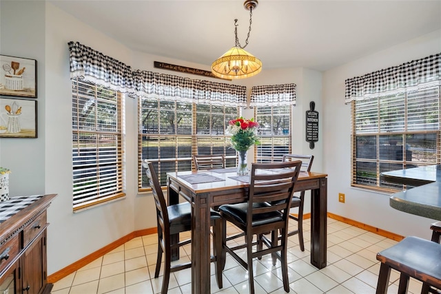 dining space with light tile patterned floors