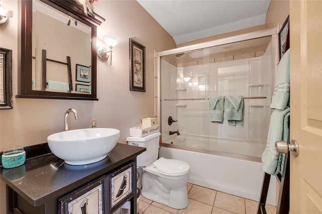 full bathroom with tile patterned floors, toilet, shower / bath combination with glass door, a textured ceiling, and vanity