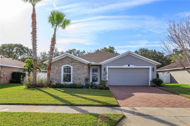 ranch-style house with a garage and a front yard