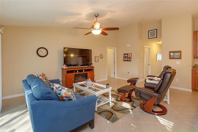 living room featuring ceiling fan and light tile patterned flooring