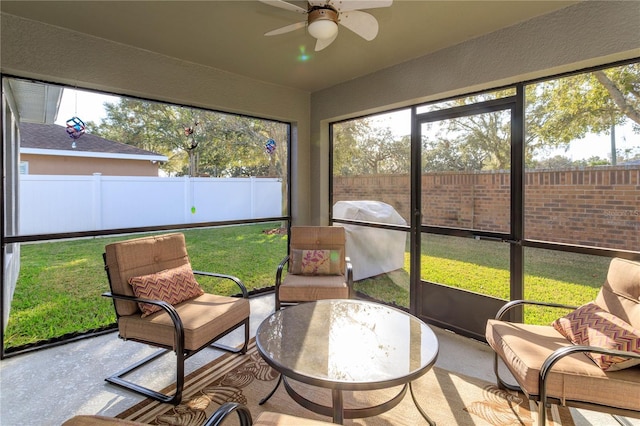 sunroom / solarium featuring ceiling fan and a healthy amount of sunlight