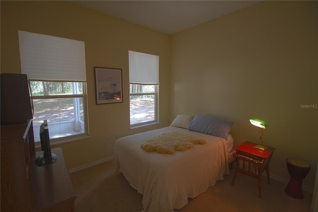 bedroom featuring light colored carpet