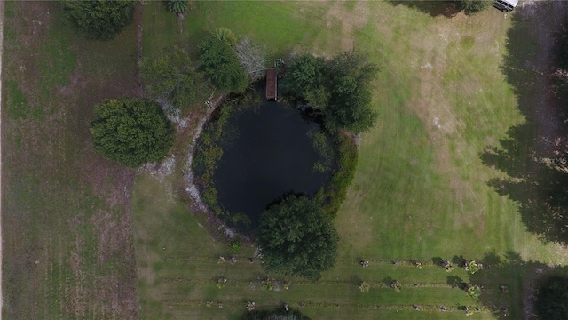 drone / aerial view featuring a water view and a rural view