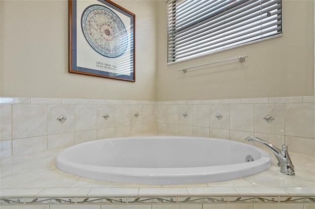 bathroom with a relaxing tiled tub