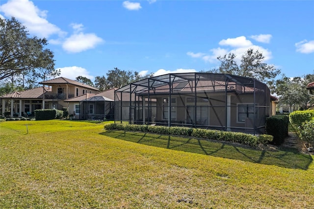 view of yard with glass enclosure