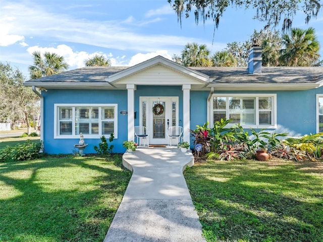 view of front of property with a front lawn