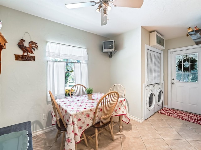 dining area featuring washer and dryer, ceiling fan, and light tile patterned flooring