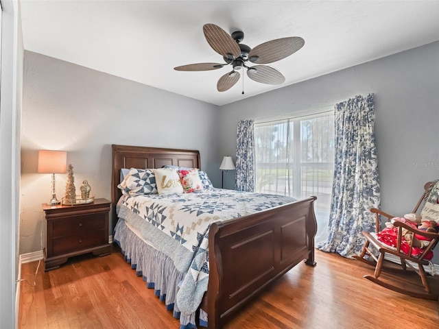 bedroom featuring ceiling fan and light wood-type flooring