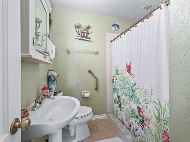 bathroom featuring tile patterned flooring, a shower with curtain, and sink