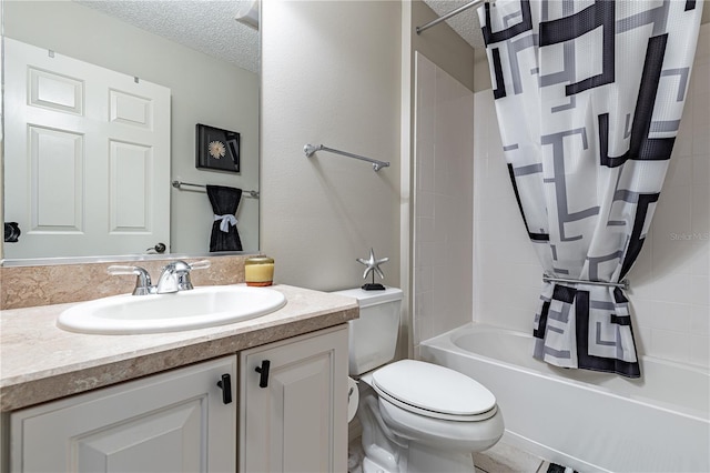 full bathroom featuring vanity, shower / bath combo, a textured ceiling, and toilet