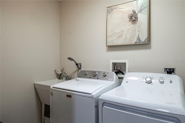 laundry area featuring washing machine and clothes dryer