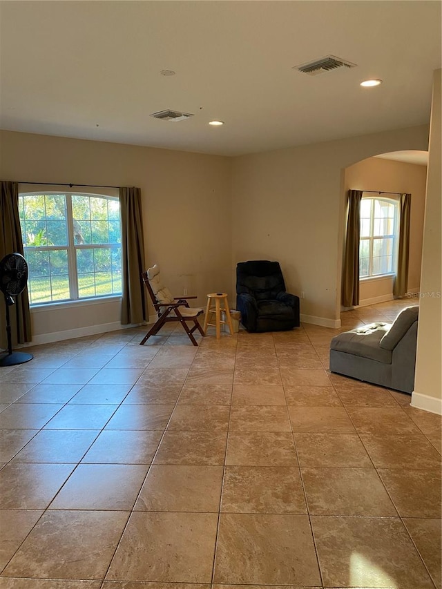 unfurnished room featuring light tile patterned floors