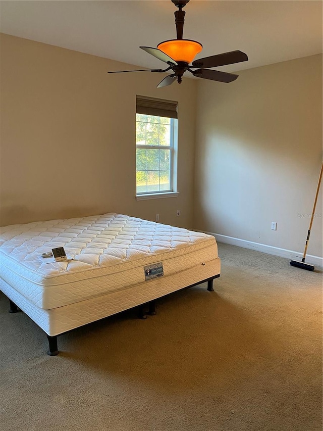 unfurnished bedroom featuring carpet flooring and ceiling fan