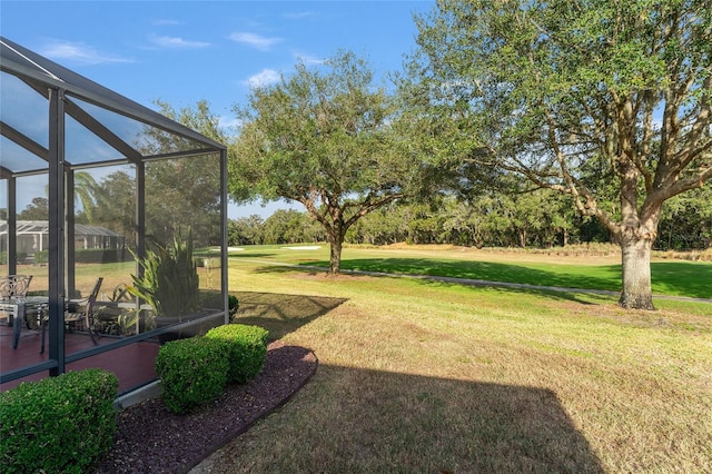 view of yard featuring glass enclosure