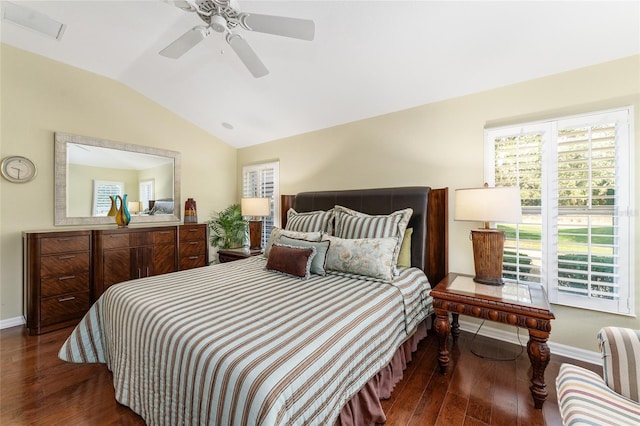 bedroom with vaulted ceiling, ceiling fan, and dark hardwood / wood-style floors