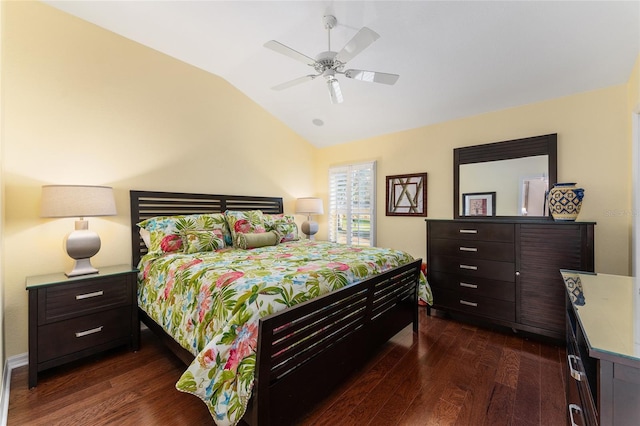 bedroom with vaulted ceiling, ceiling fan, and dark wood-type flooring