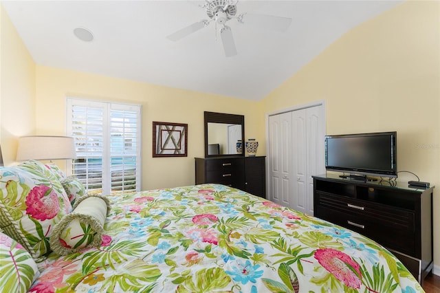 bedroom featuring ceiling fan, vaulted ceiling, and a closet