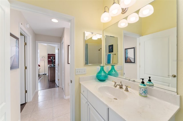 bathroom with tile patterned flooring and vanity