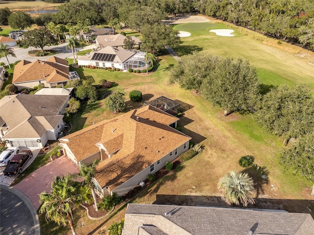 birds eye view of property with view of golf course and a residential view