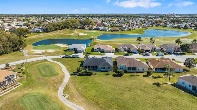 birds eye view of property with a residential view, a water view, and golf course view