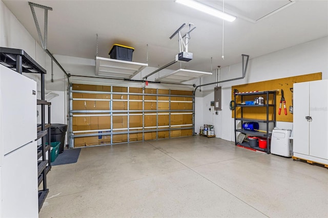 garage with electric panel and a garage door opener