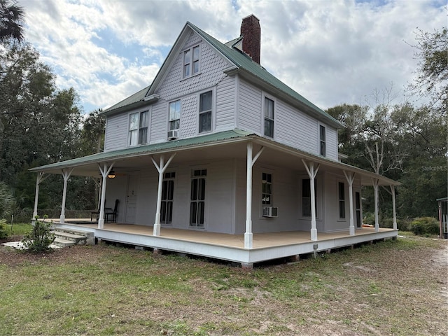 farmhouse with a porch and cooling unit