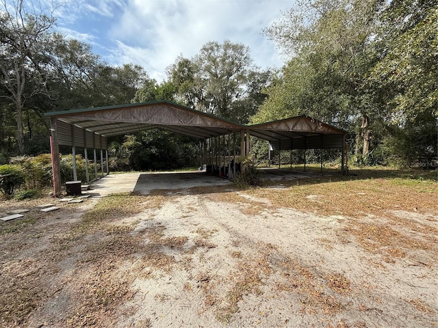 view of parking / parking lot with a carport