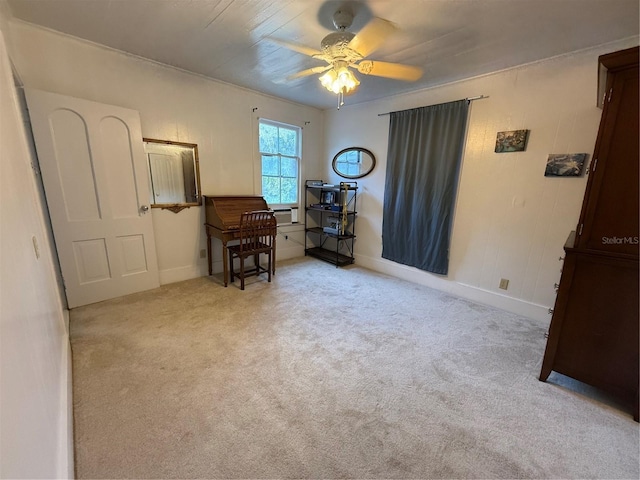 interior space featuring light colored carpet and ceiling fan