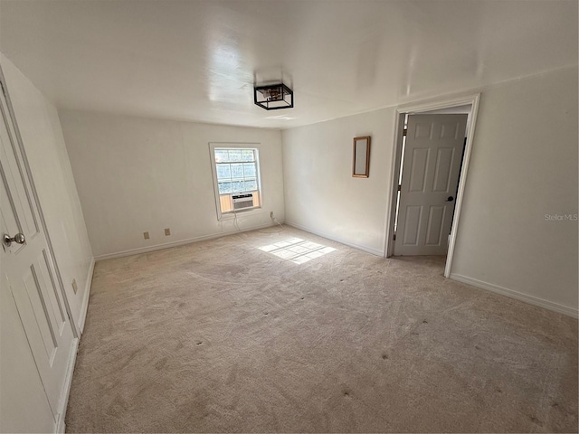 carpeted empty room featuring cooling unit