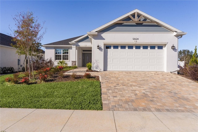 view of front of home featuring a front yard and a garage