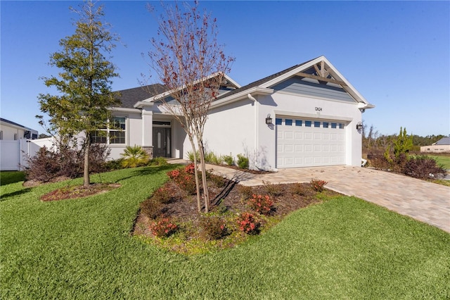 view of front of property with a garage and a front yard