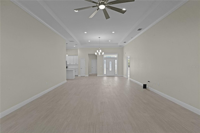 unfurnished living room featuring light hardwood / wood-style flooring, ceiling fan with notable chandelier, and ornamental molding