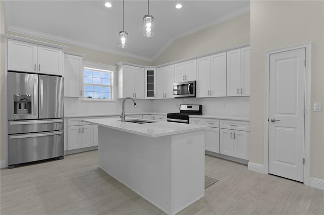 kitchen with sink, white cabinetry, stainless steel appliances, and hanging light fixtures