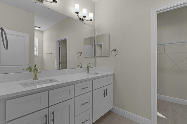 bathroom featuring vanity and wood-type flooring