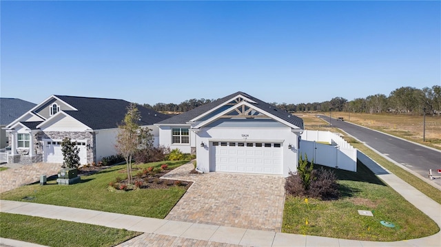 view of front facade with a garage and a front lawn